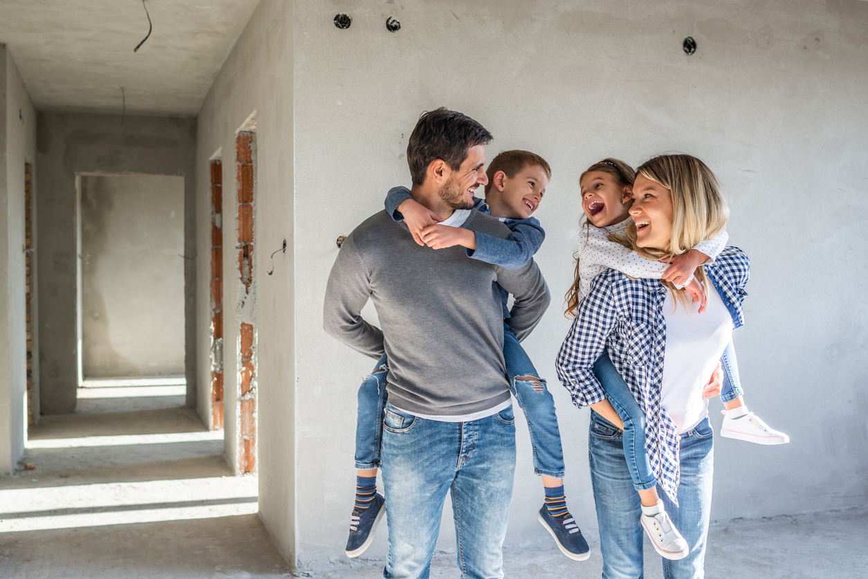 Happy family looking their new home